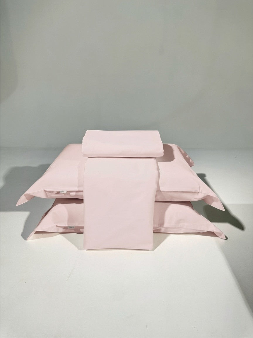 Kit de lençóis Cozybed home 400 fios 100% algodão em percal acetinado cor rosa claro. Inclui lençol de cima, lençol com elástico e fronhas.